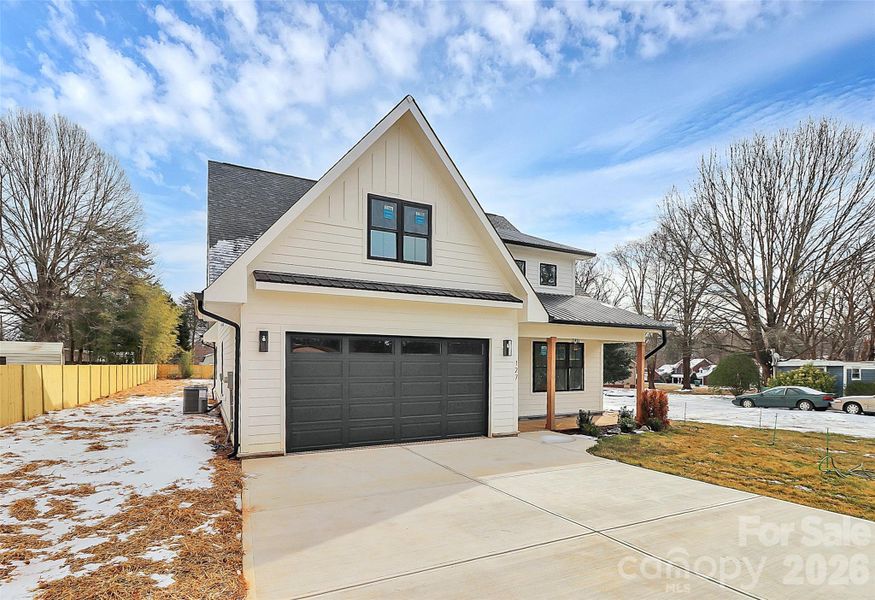 Front exterior of a new home in , Mooresville, NC, highlighting curb appeal (Image 24).