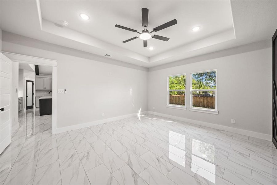 Spare room with recessed lighting, ceiling fan, and light marble finish floors