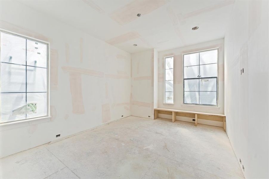 Upstairs bedroom with a window seat, a comfortable spot to relax and enjoy a book.