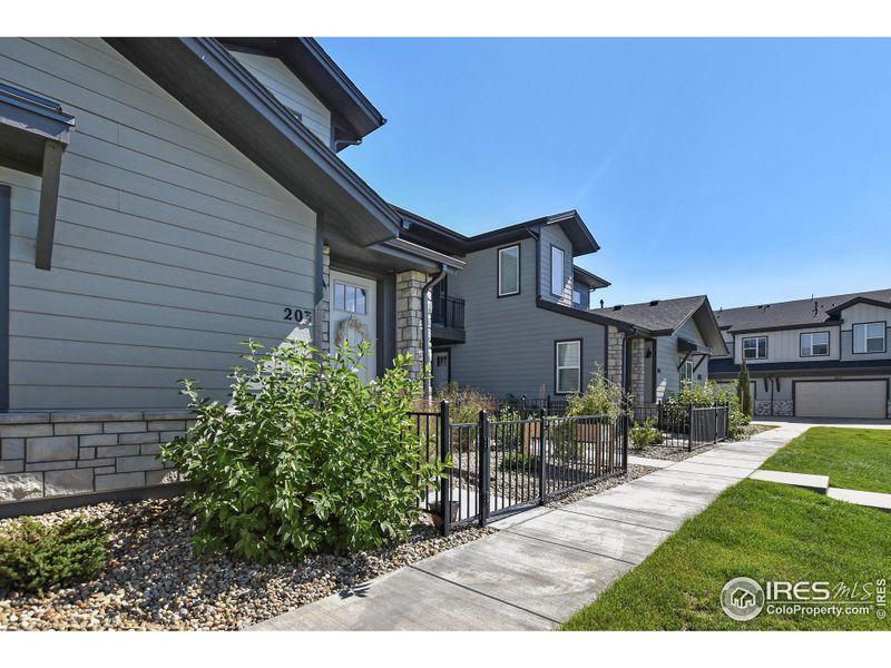 Front exterior of a new home in , Timnath, CO, highlighting curb appeal (Image 22).