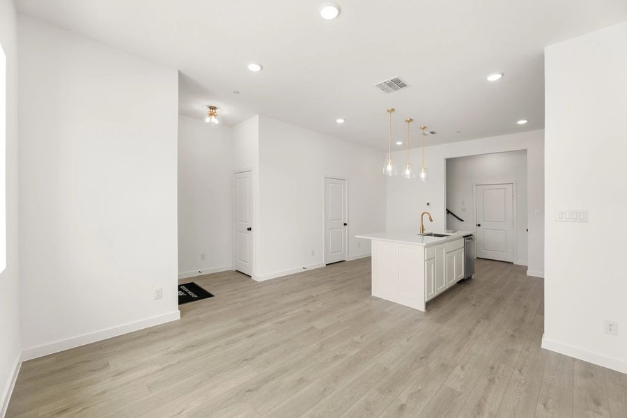 Open Kitchen-Living-Dining room featuring the Serene Collection