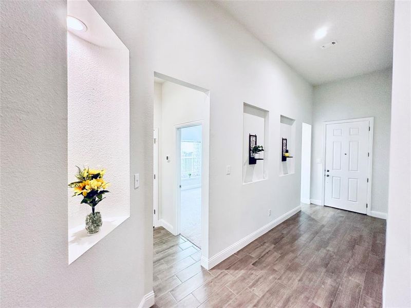 Corridor featuring hardwood / wood-style flooring