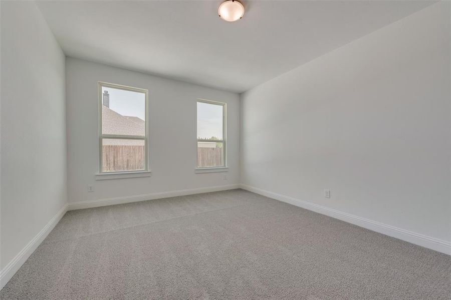 Unfurnished room with carpet flooring