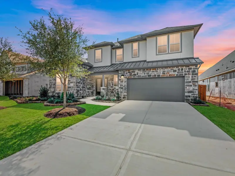 Front exterior of a new home in , Cypress, TX, highlighting curb appeal (Image 2). Front exterior of a new home in , Cypress, TX, highlighting curb appeal (Image 2).