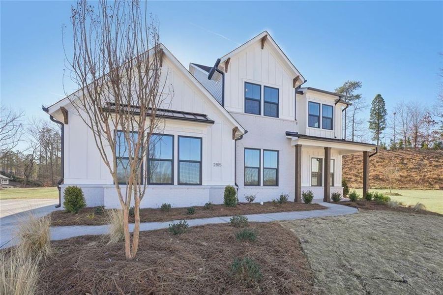 Front exterior of a new home in Sterling Pointe, Cumming, GA, highlighting curb appeal (Image 26).