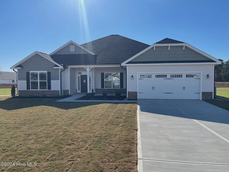 Front exterior of a new home in Williams Grove, Bailey, NC, highlighting curb appeal (Image 1). Front exterior of a new home in Williams Grove, Bailey, NC, highlighting curb appeal (Image 1).