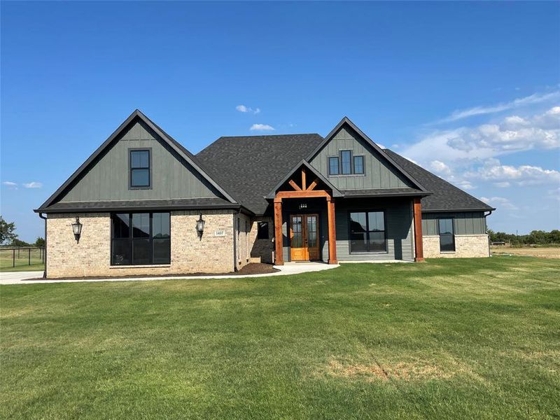 View of front of home featuring a front lawn