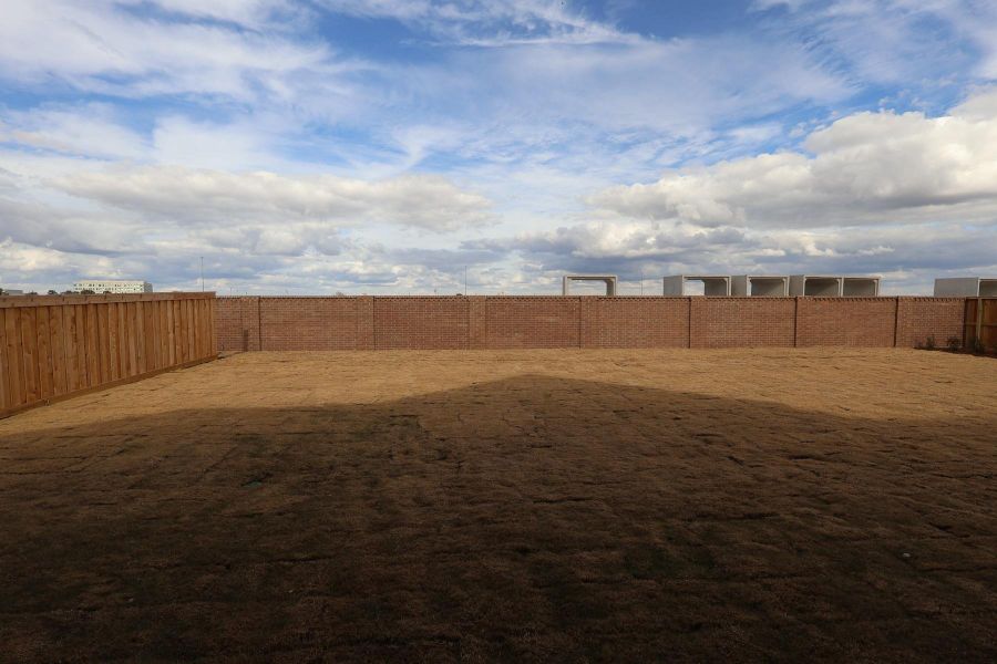 Exterior details and patio area of a home in Dunham Pointe, Cypress (Image 20).
