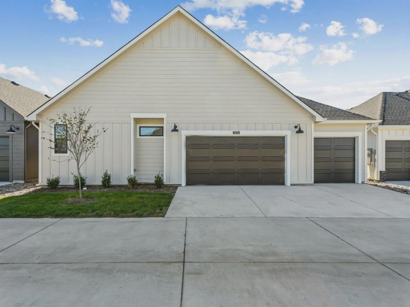 Front exterior of a new home in The Courtyards at The Moorings, Wichita, KS, highlighting curb appeal (Image 11). Front exterior of a new home in The Courtyards at The Moorings, Wichita, KS, highlighting curb appeal (Image 11).