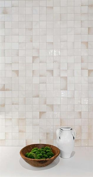 Gorgeous countertop to ceiling tiled backsplash.