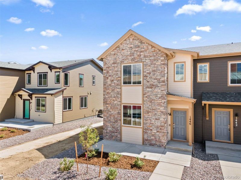 Front exterior of a new home in Spring Valley, Longmont, CO, highlighting curb appeal (Image 21).