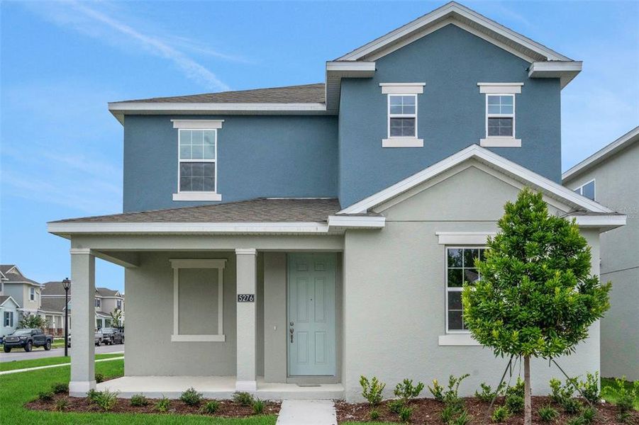 Front exterior of a new home in Crossroads at Kelly Park, Apopka, FL, highlighting curb appeal (Image 20).