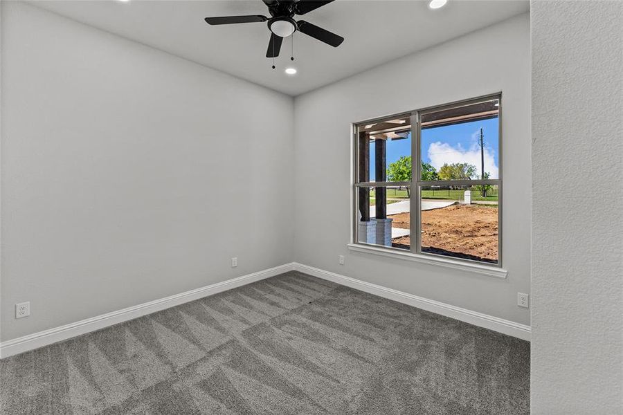 Carpeted spare room with recessed lighting and a ceiling fan Carpeted spare room with recessed lighting and a ceiling fan