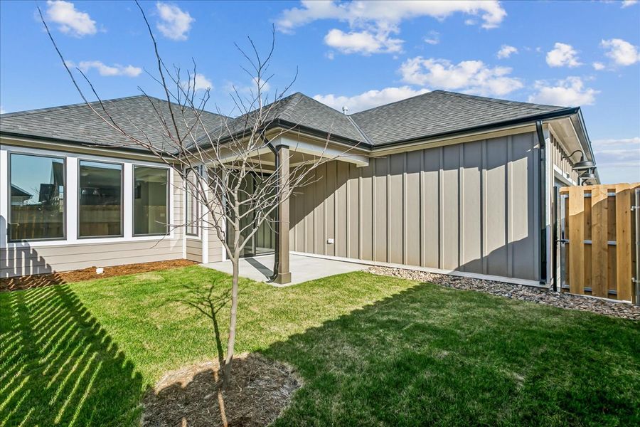 Exterior details and patio area of a home in The Courtyards at Jacobs Farm, Wichita (Image 3).