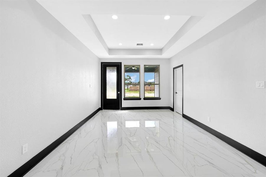 The living room and dining area have plenty of natural light, making them bright and welcoming.