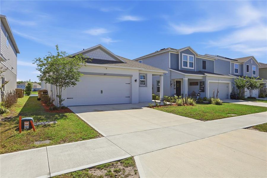 Front exterior of a new home in , St. Cloud, FL, highlighting curb appeal (Image 26).