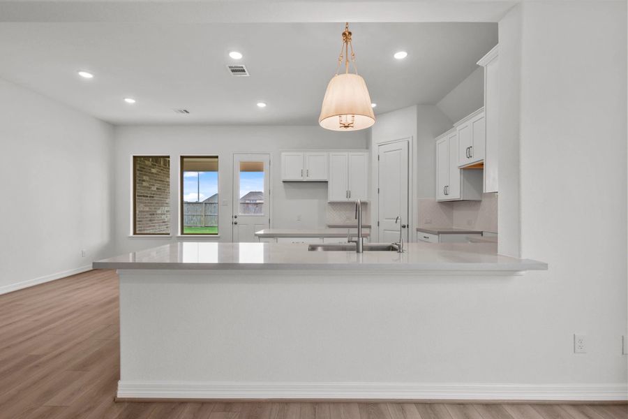 Kitchen.  Sample product photo. Actual exterior and interior selections may vary by homesite. Photo may be virtually staged.