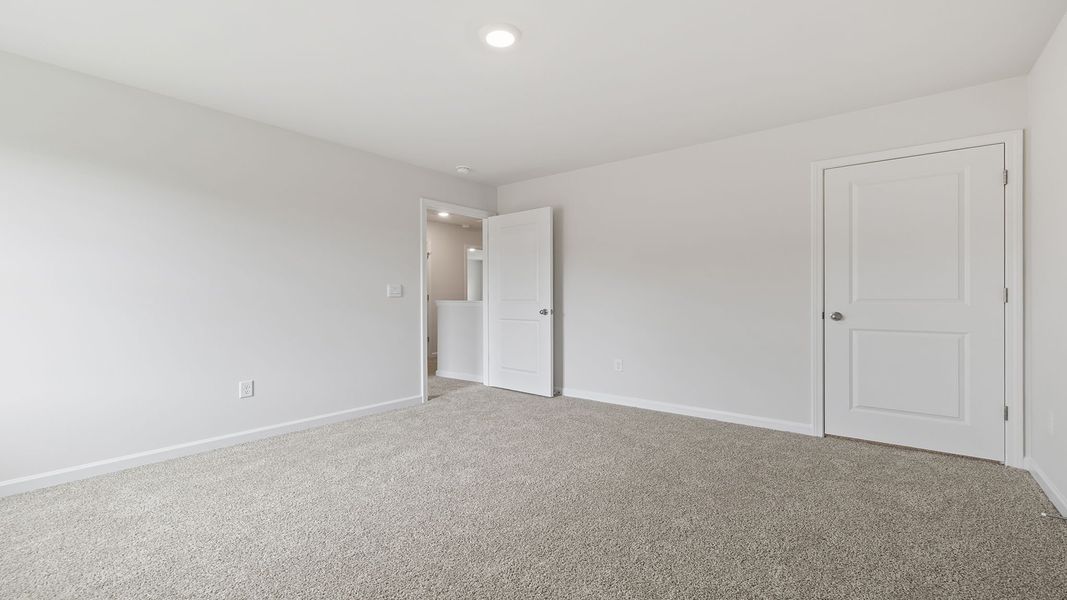 Spacious, unfurnished interior of a new home in Bentley Park, Greenwood (Image 26).