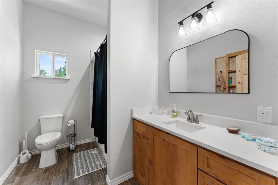 Guest bathroom with tub/shower combo, built in soap nook.