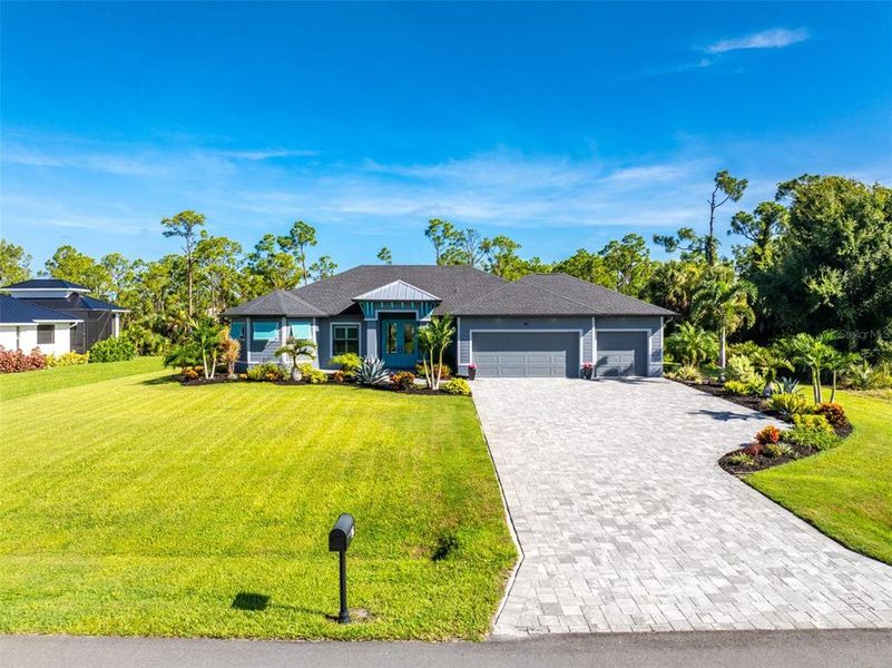 Front exterior of a new home in , Rotonda West, FL, highlighting curb appeal (Image 26).