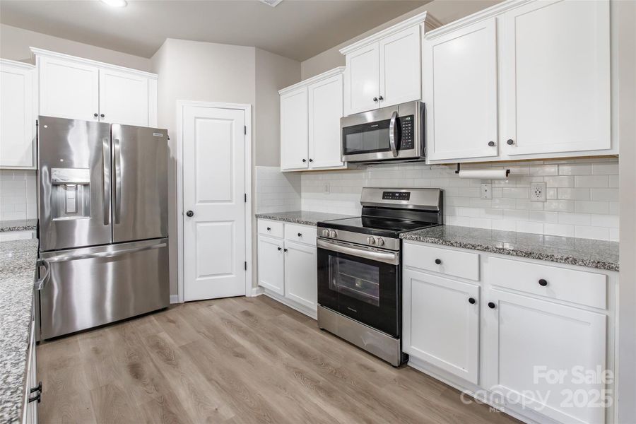 Furnished interior view inside a new home in McGee Place, Charlotte (Image 18).