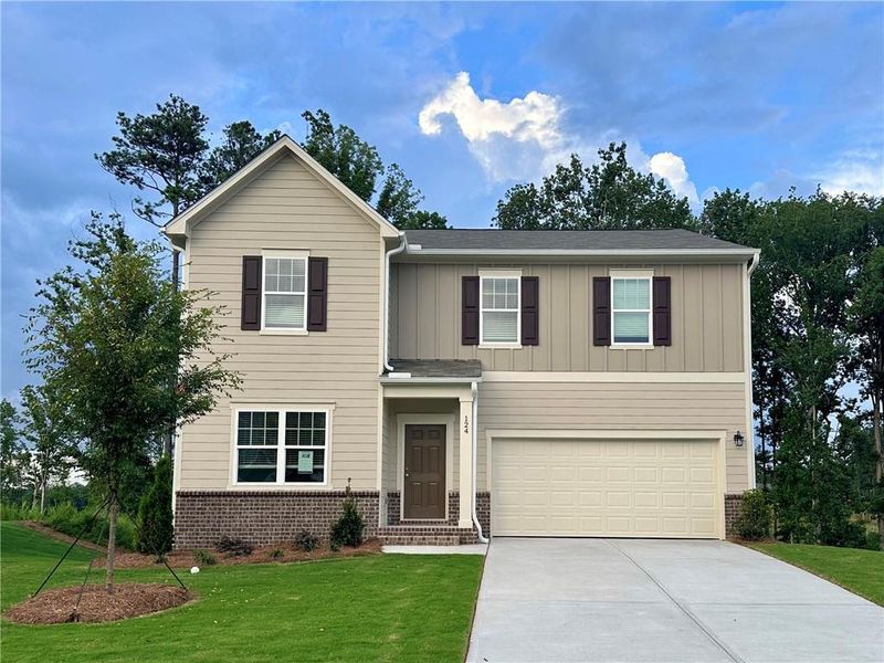 Front exterior of a new home in Mt. Tabor Ridge, Dallas, GA, highlighting curb appeal (Image 2). Front exterior of a new home in Mt. Tabor Ridge, Dallas, GA, highlighting curb appeal (Image 2).