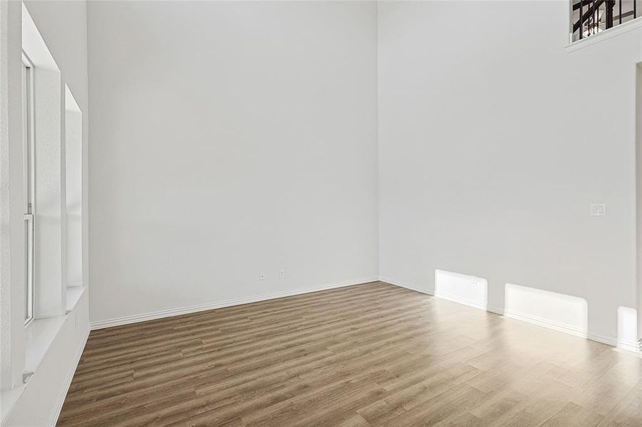 Empty room featuring wood-type flooring