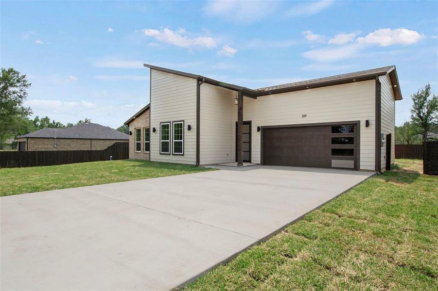 Front exterior of a new home in , Tool, TX, highlighting curb appeal (Image 2). Front exterior of a new home in , Tool, TX, highlighting curb appeal (Image 2).