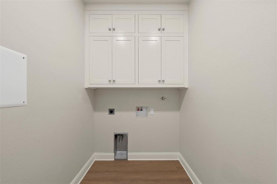 White shaker cabinetry with silver-tone hardware