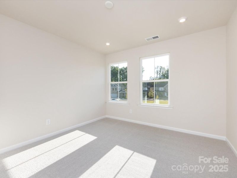 Secondary bedroom with energy efficient windows.