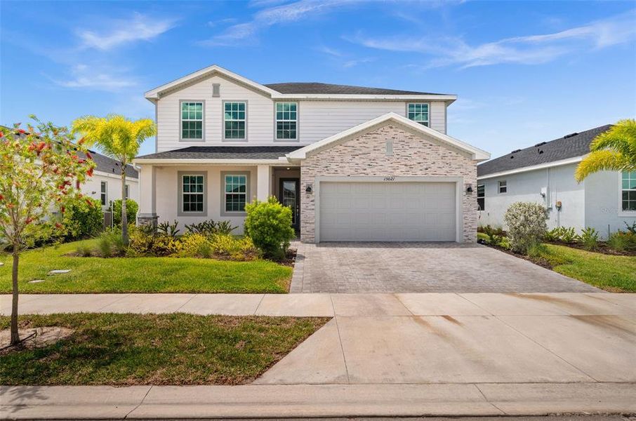 Front exterior of a new home in Tuckers Cove, Punta Gorda, FL, highlighting curb appeal (Image 27).