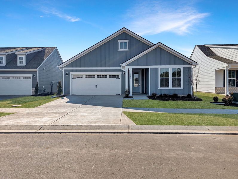 Front exterior of a new home in Del Webb Wilmington at Mallory Creek, Leland, NC, highlighting curb appeal (Image 16).