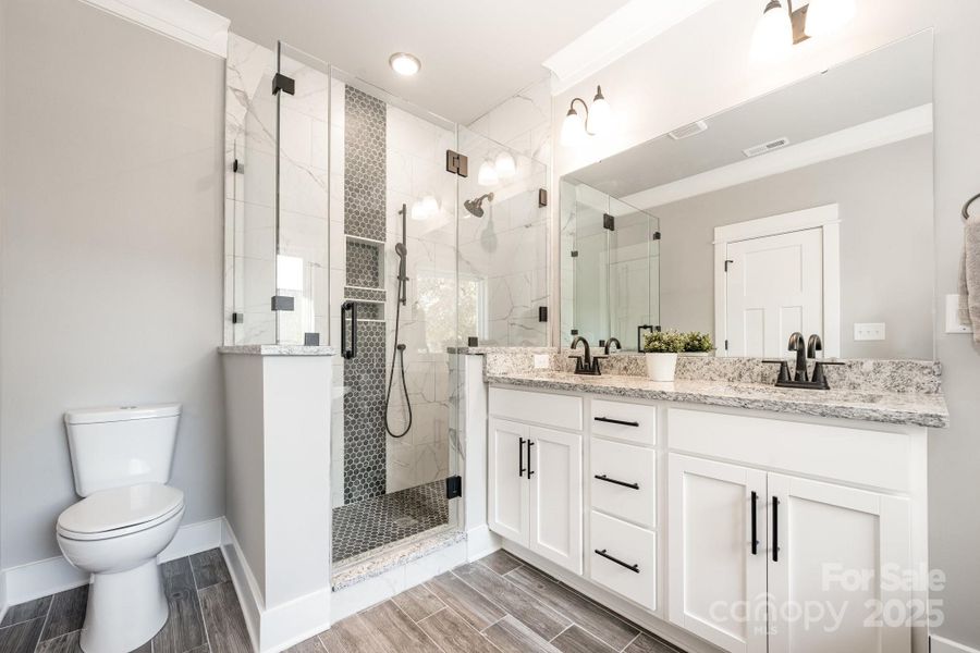 Dual sinks and beautiful shower in primary