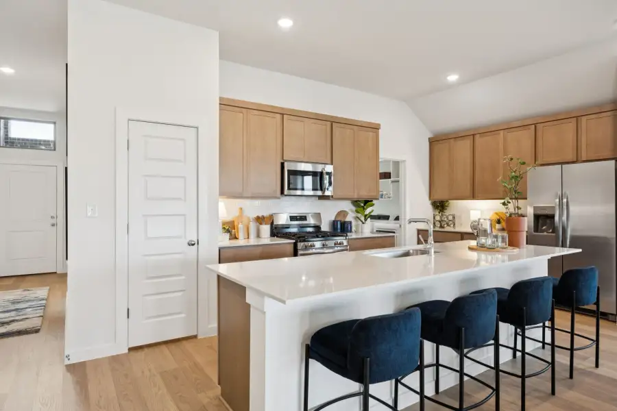 Kitchen in the Diamond home plan by Trophy Signature Homes – REPRESENTATIVE PHOTO