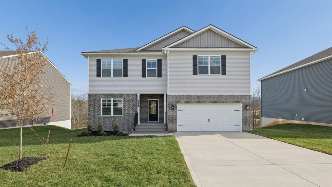 Front exterior of a new home in Whispering Springs, Maryville, TN, highlighting curb appeal (Image 1). Front exterior of a new home in Whispering Springs, Maryville, TN, highlighting curb appeal (Image 1).