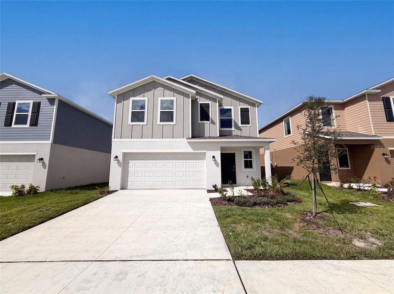 Front exterior of a new home in Ranches at Lake Mcleod, Eagle Lake, FL, highlighting curb appeal (Image 16).