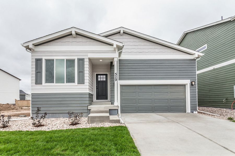Front exterior of a new home in Bloom, Fort Collins, CO, highlighting curb appeal (Image 26). Front exterior of a new home in Bloom, Fort Collins, CO, highlighting curb appeal (Image 26).