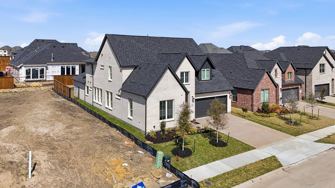 Front exterior of a new home in Brookhollow West, Prosper, TX, highlighting curb appeal (Image 24). Front exterior of a new home in Brookhollow West, Prosper, TX, highlighting curb appeal (Image 24).
