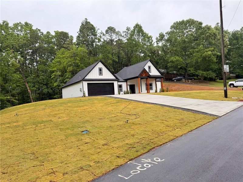 Front exterior of a new home in , Cartersville, GA, highlighting curb appeal (Image 24).