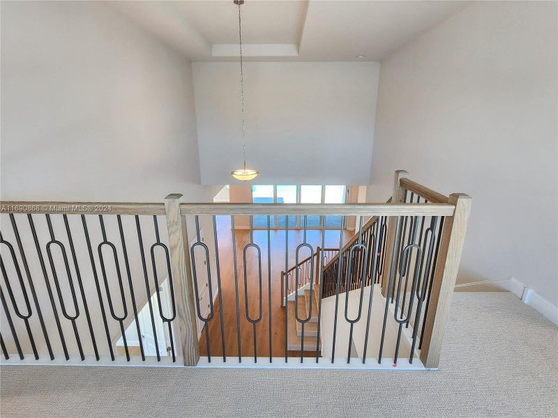 walkway at top of stairs connecting Loft to two bedrooms