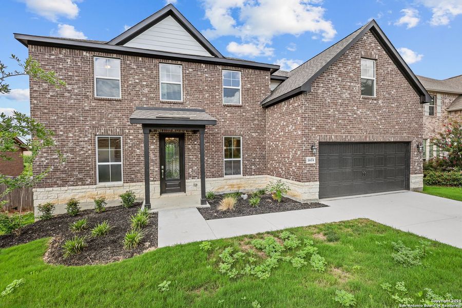 Front exterior of a new home in Ladera, San Antonio, TX, highlighting curb appeal (Image 4).