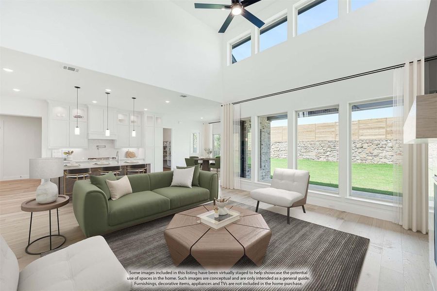 Open-concept living room with vaulted ceiling, large windows, and view of white kitchen beyond