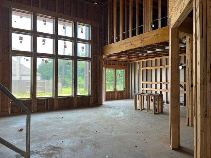 Family room highlighting the wall of windows looking into the back yard. Family room highlighting the wall of windows looking into the back yard.