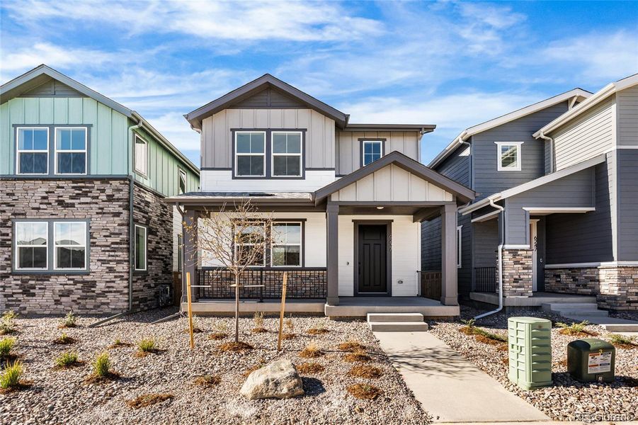 Front exterior of a new home in Painted Prairie, Aurora, CO, highlighting curb appeal (Image 2). Front exterior of a new home in Painted Prairie, Aurora, CO, highlighting curb appeal (Image 2).
