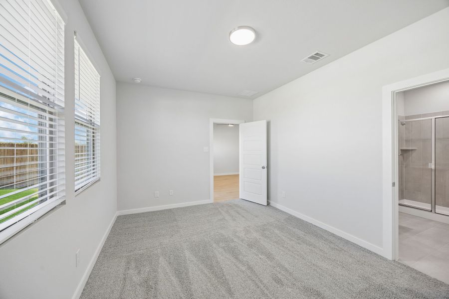 Primary Bedroom in the Birch home plan by Trophy Signature Homes – REPRESENTATIVE PHOTO