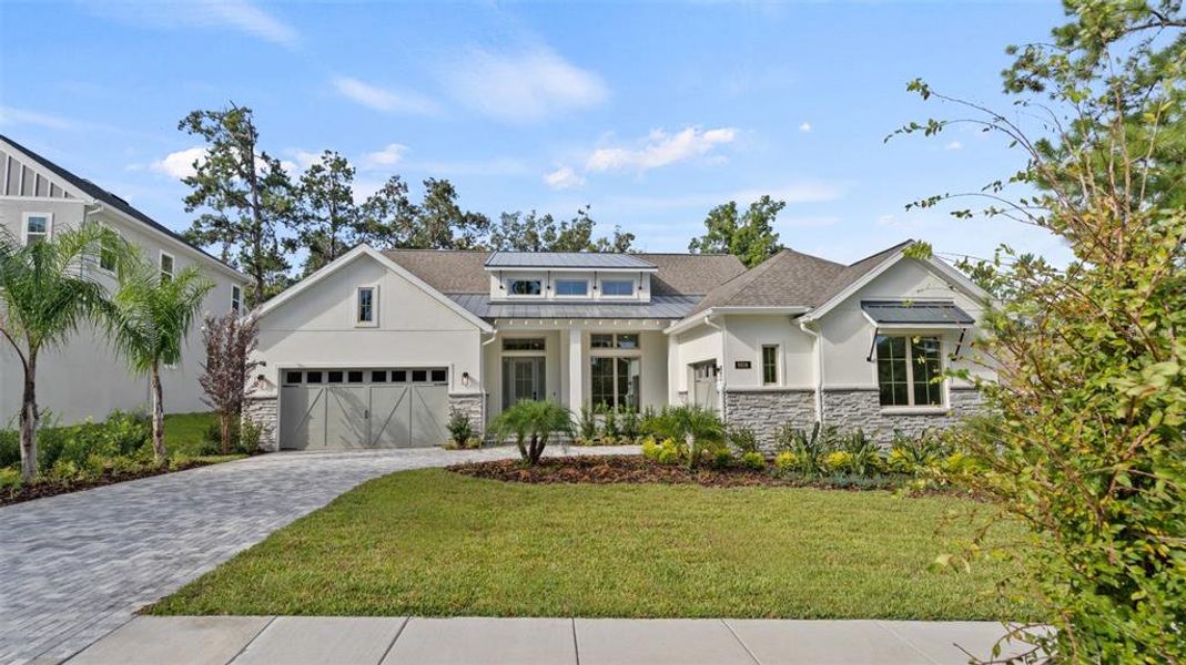 Front exterior of a new home in Southern Hills 80', Brooksville, FL, highlighting curb appeal (Image 1).