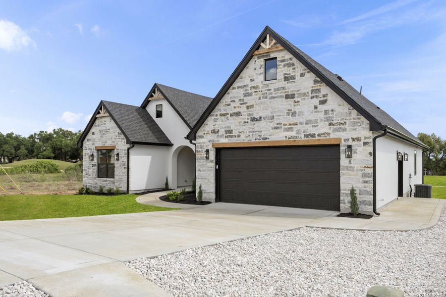 Front exterior of a new home in , Blanco, TX, highlighting curb appeal (Image 24). Front exterior of a new home in , Blanco, TX, highlighting curb appeal (Image 24).