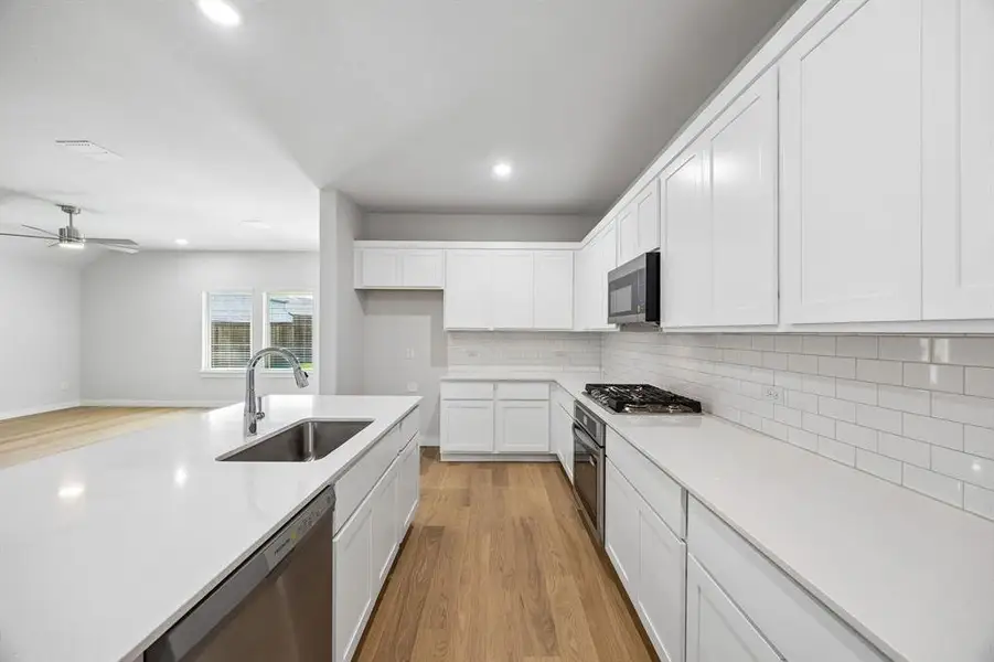 Kitchen in the Oscar home plan by Trophy Signature Homes – REPRESENTATIVE PHOTO Kitchen in the Oscar home plan by Trophy Signature Homes – REPRESENTATIVE PHOTO