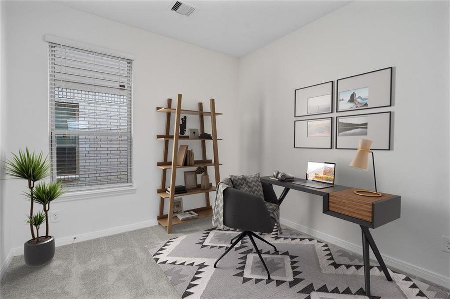 This downstairs flex space would be perfect for a home office. Featuring plush carpet, custom paint and a large window.