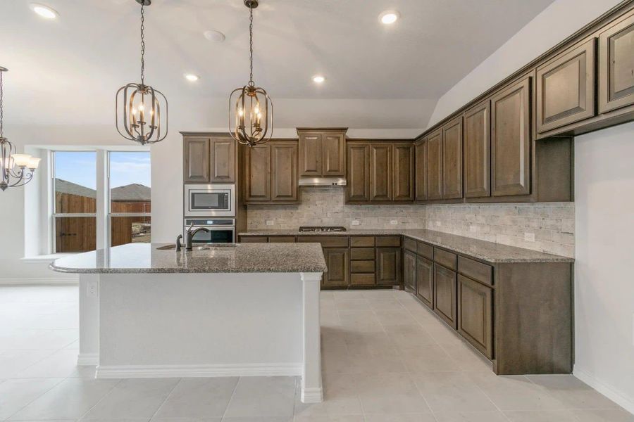 Kitchen | Concept 1841 at Coyote Crossing in Godley, TX by Landsea Homes